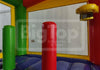 Colorful inflatable bounce house with red and green posts, featuring Big Top Inflatables & Tents branding.