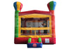 Colorful inflatable bounce house with transparent sides on a white background