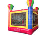 Colorful inflatable bounce house with transparent panels on a white background