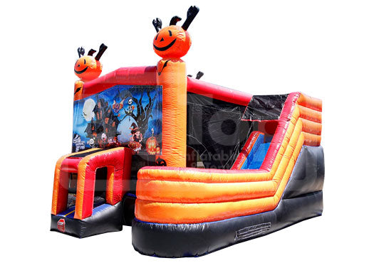 Halloween-themed inflatable slide with cartoon pumpkin faces on a white background