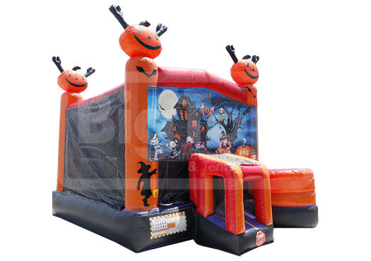 Halloween-themed inflatable bounce house with pumpkin design on a white background