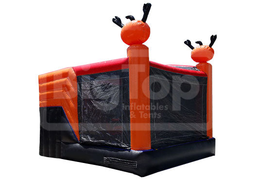 Inflatable bounce house with red and black design on a white background