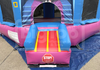 Pink and blue inflatable obstacle course with a 'STOP!' sign on a tarp.