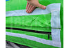 Close-up of a bright green inflatable pool or play mat with white trim and a black zipper, held by a hand to show flexibility. A large semi-transparent 'Big Top Inflatables' watermark is visible across the center.