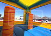 Colorful inflatable obstacle course with cylindrical obstacles on a sunny day.