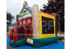 A colorful inflatable farm-themed bouncy castle with a slide, set up outdoors on a blue ground cover. The castle features a red barn, yellow and beige silo, green base, and a gray roof with a cartoon character.