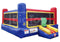 A colorful inflatable bounce house with a slide, featuring blue, red, yellow, and black sections, shown against a plain white background.