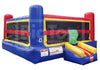 A colorful inflatable bounce house with a slide, featuring blue, red, yellow, and black sections, shown against a plain white background.