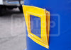 A close-up of a bright yellow inflatable window or door panel with white stitching, mounted on a blue container.