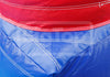 Close-up of an inflatable tent or bag showing a red upper section and a blue lower section with white stitching.