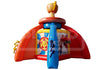 Inflatable toy castle play structure with red walls, a blue central tower, yellow accents, and printed graphics on the front, isolated on a white background.