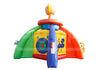 A colorful inflatable playground or bounce house with a yellow center, green left side, orange right side, and a blue vertical slide, isolated on a white background.