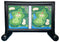 Golf simulator screen with two identical golf course layouts on a black stand.
