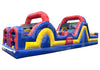 A large inflatable obstacle course slide with red, yellow, and blue sections, shown on a plain white background.
