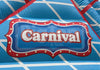 Blue inflatable tent with 'Carnival & Tents' sign on a blue background