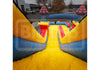 Colorful inflatable slide with various structures in an outdoor setting.