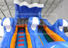 Colorful inflatable slide with blue, orange, and red colors in an indoor setting.