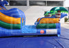 Inflatable water slide with shark design on a blue tarp