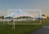 Two white 20x20 high-peak frame tents with an anodized aluminum frames and block-out vinyl material tops, designed for elegant look and clear open floor without center poles.