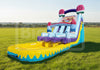 Colorful inflatable water slide on a grassy field with a clear sky.